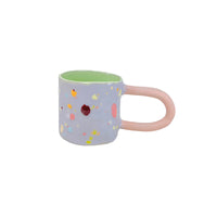 Lilac Dot mug with matte peach glazed handle and palegreen inner glaze