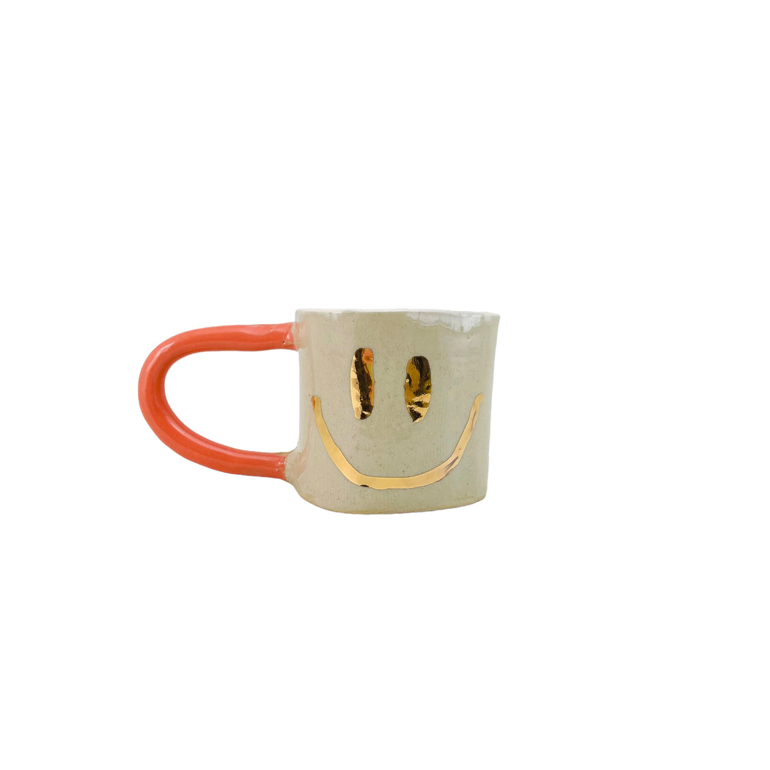 Guld Smiley Krus med orange hank og creme-farvet indre.